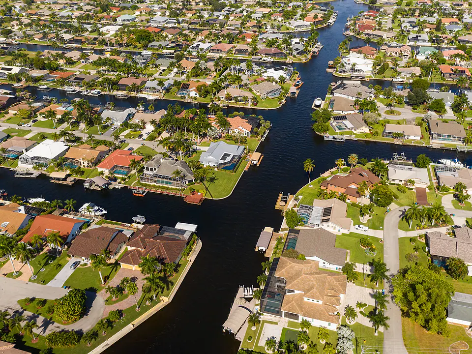 Aerial view of a Florida waterfront neighborhood along a canal